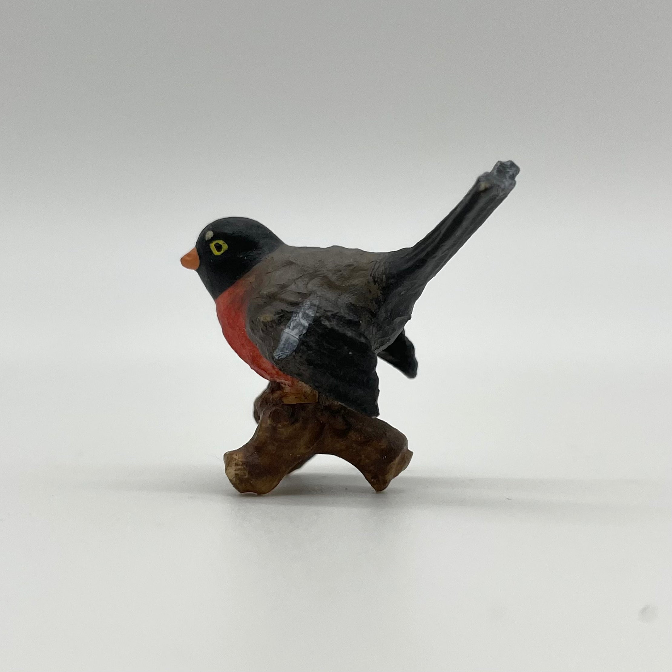 Vogel auf Ast rot/gelb Krippenfigur von Heimatkrippe